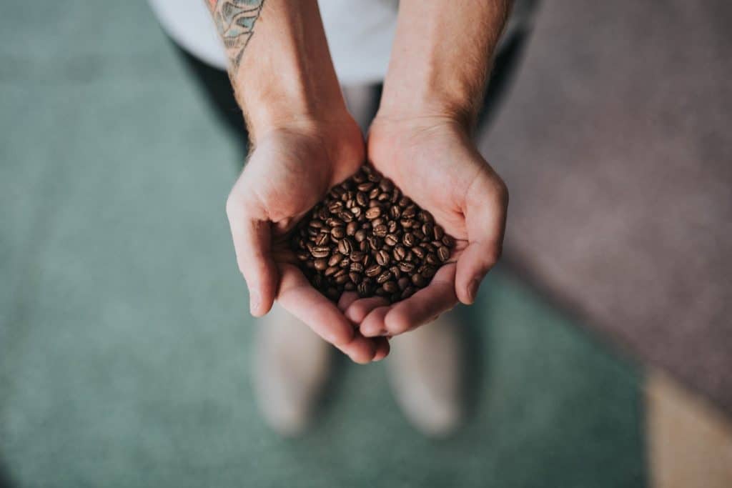 coffee beans in hand