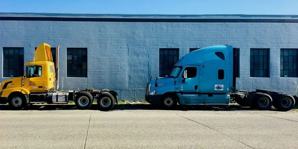 semi trucks by building